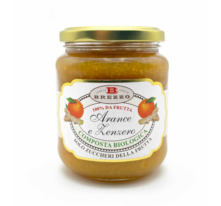 Glass jar with a gold lid containing orange fruit spread; label reads Brezzo Arance e Zenzero, 'Composta Biologica' (organic fruit spread)