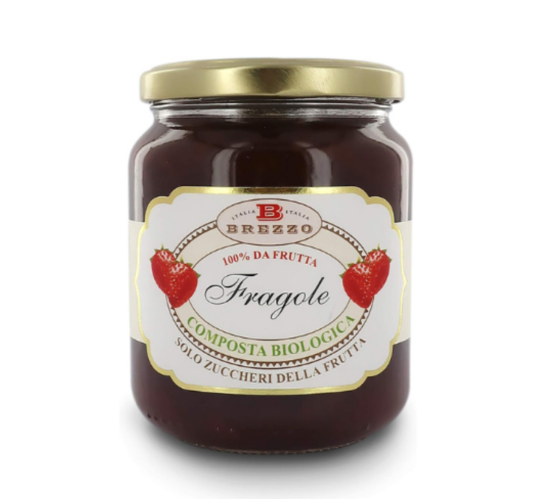 Glass jar of strawberry jam with a gold lid; label shows Fragole and Italian fruit-jam branding (100% da frutta)