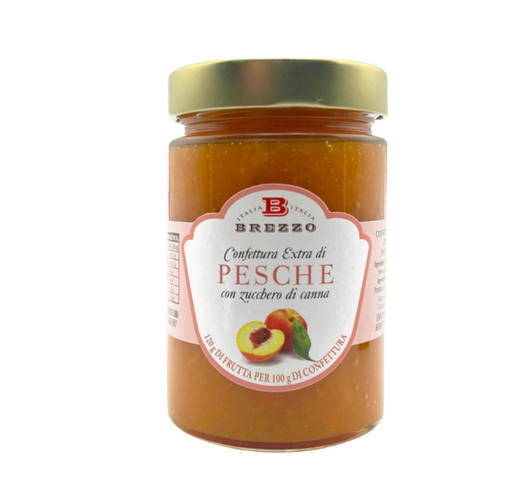 Jar of Italian peach jam in a glass jar with a gold lid and pink label showing peaches and the word ‘PESCHE’