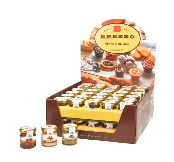 Display box of Brezzo spreadable creams with small jars arranged on shelves; Italian logo on the sign says 'Creme spalmabili'.